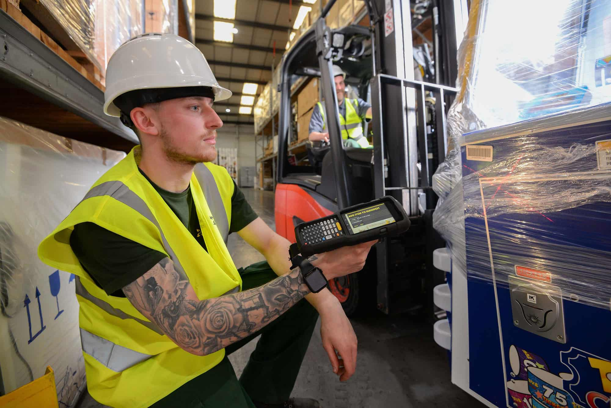 Product in warehouse being scanned by worker