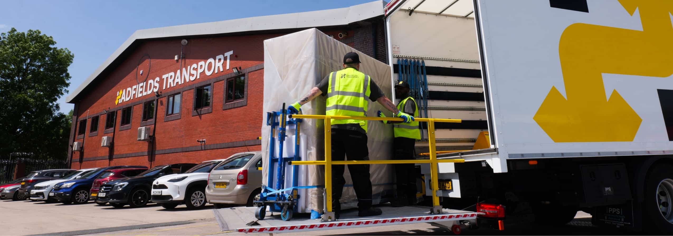 Hadfields workers on vehicle